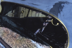 Handcoloured broken back window