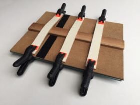 Apply the slats to the back and secure with clamps